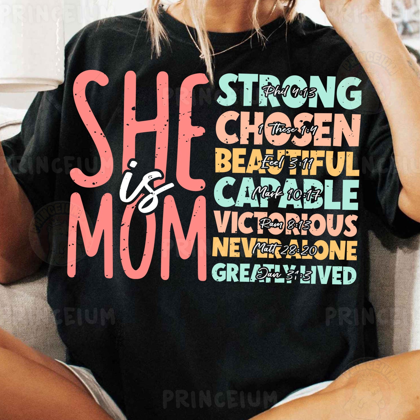 a woman sitting on a couch wearing a black shirt