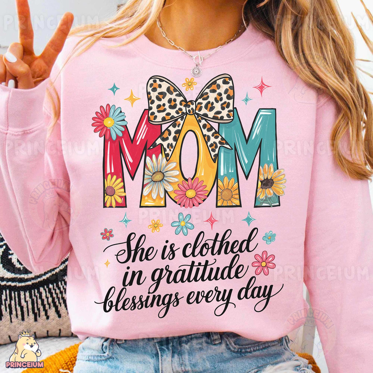a woman wearing a pink shirt that says mom