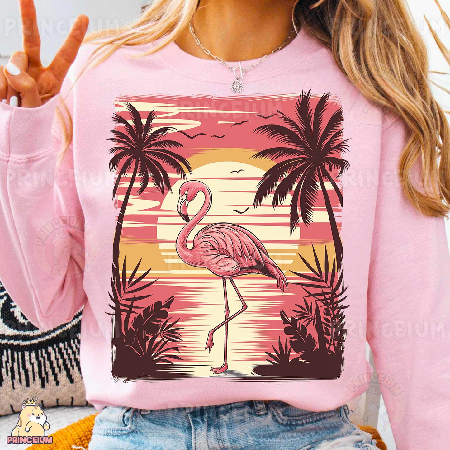 a woman wearing a pink shirt with a flamingo on it