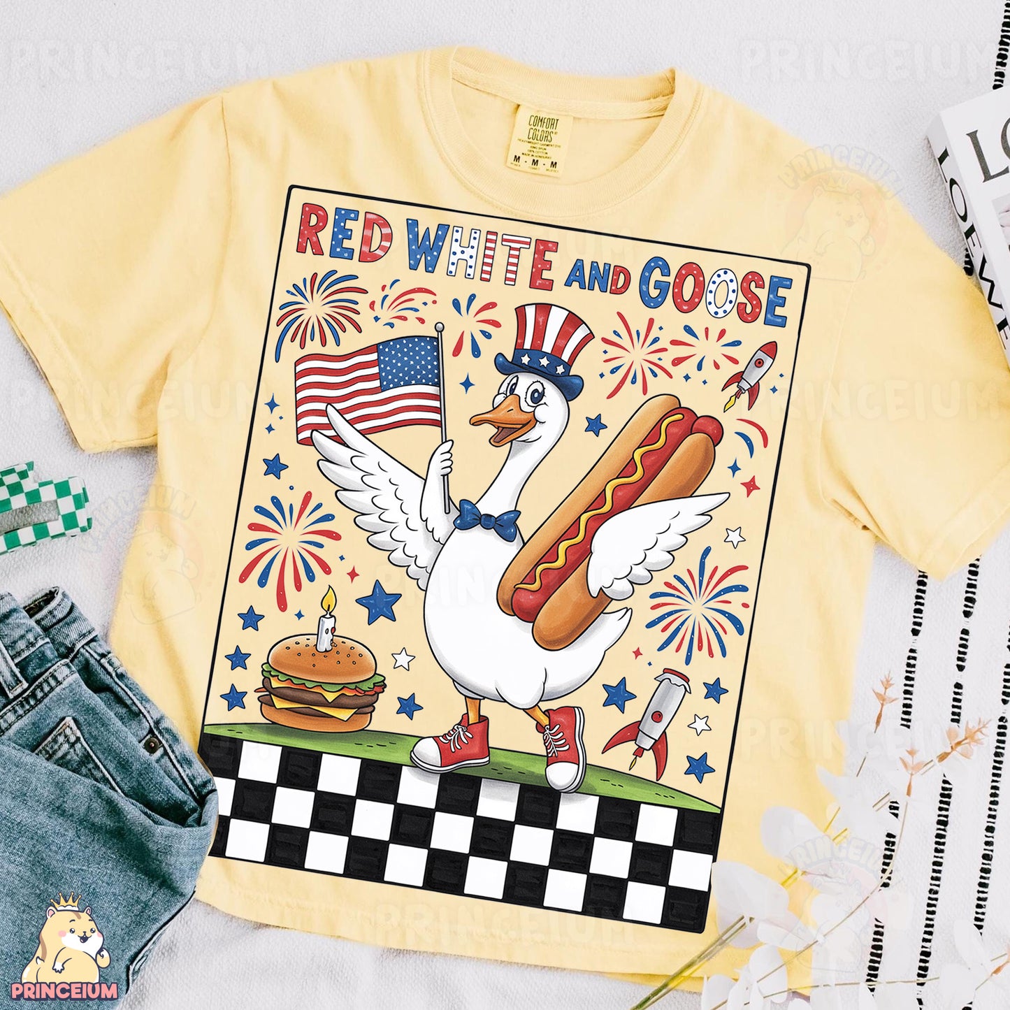 a yellow t - shirt with a picture of a chicken holding a hot dog and