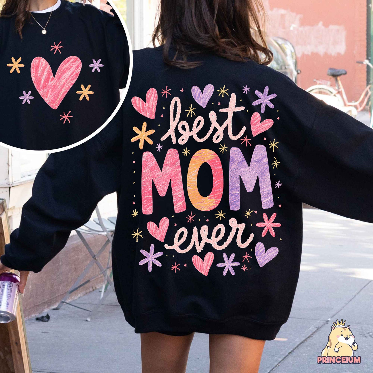 a woman wearing a sweatshirt with the words best mom ever printed on it