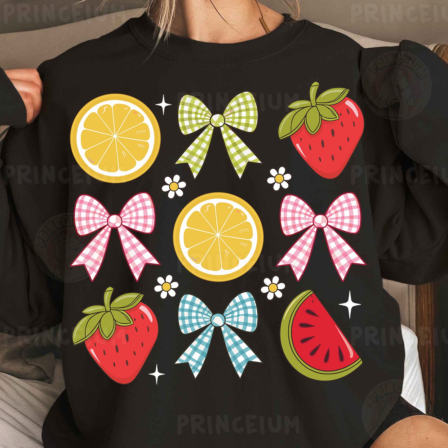 a woman wearing a black shirt with fruit and bows on it