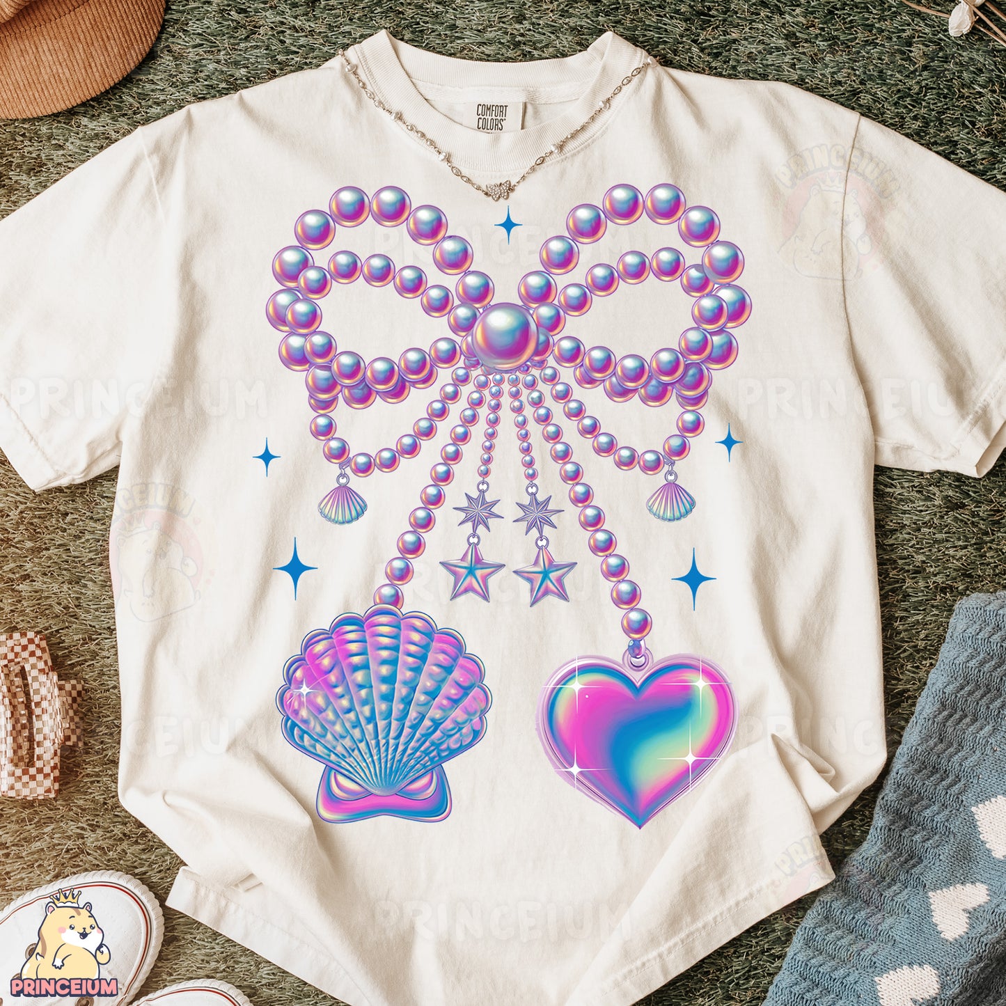 a t - shirt with a design of pearls and seashells