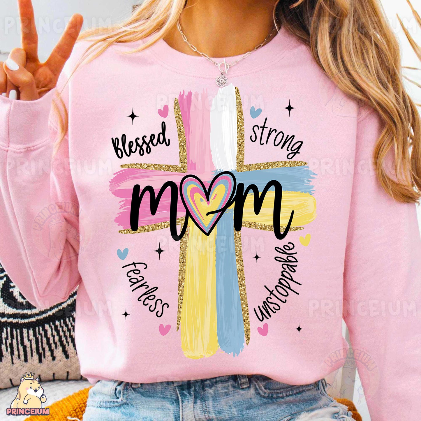 a woman wearing a pink shirt with a cross on it