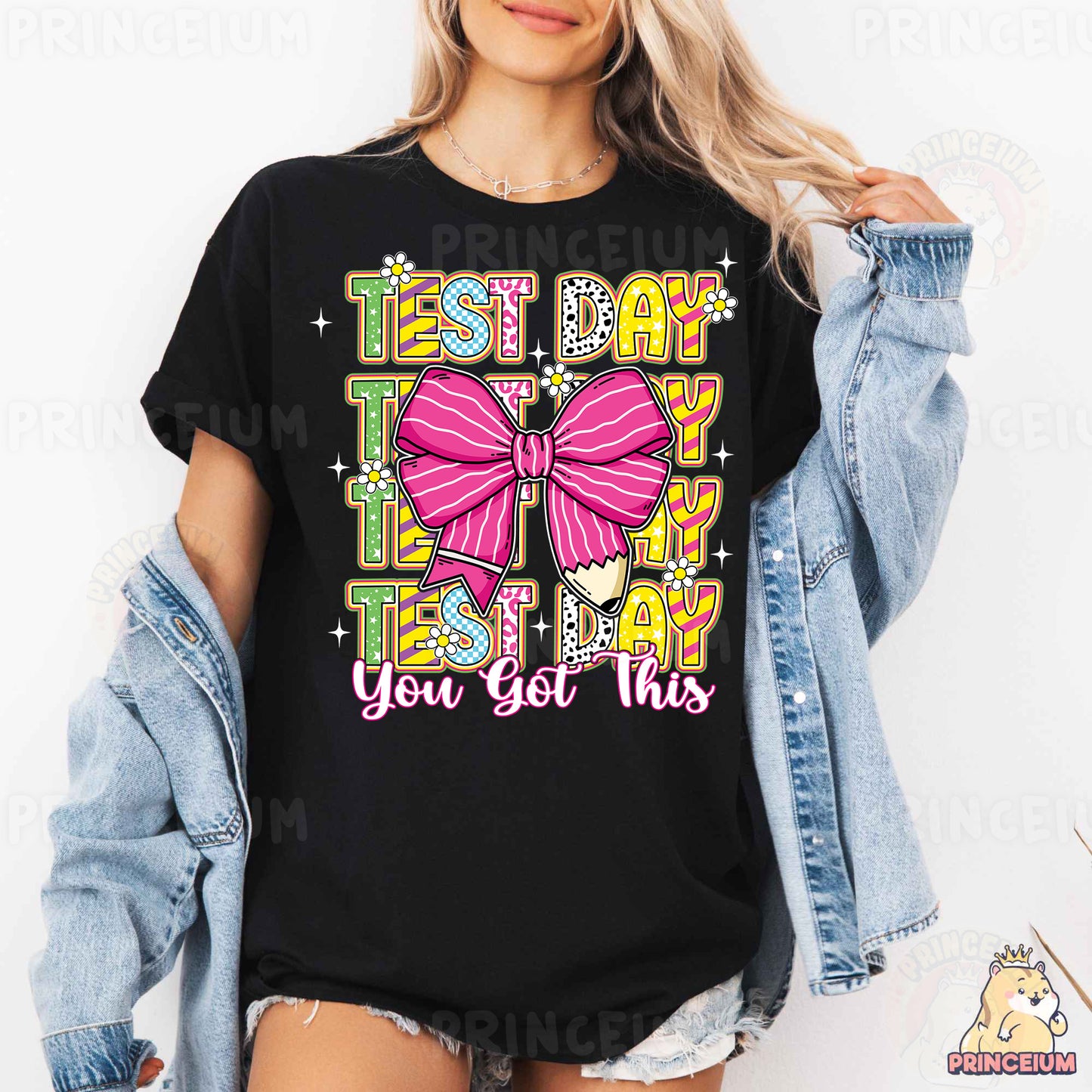 a woman wearing a black tshirt with a pink bow on it