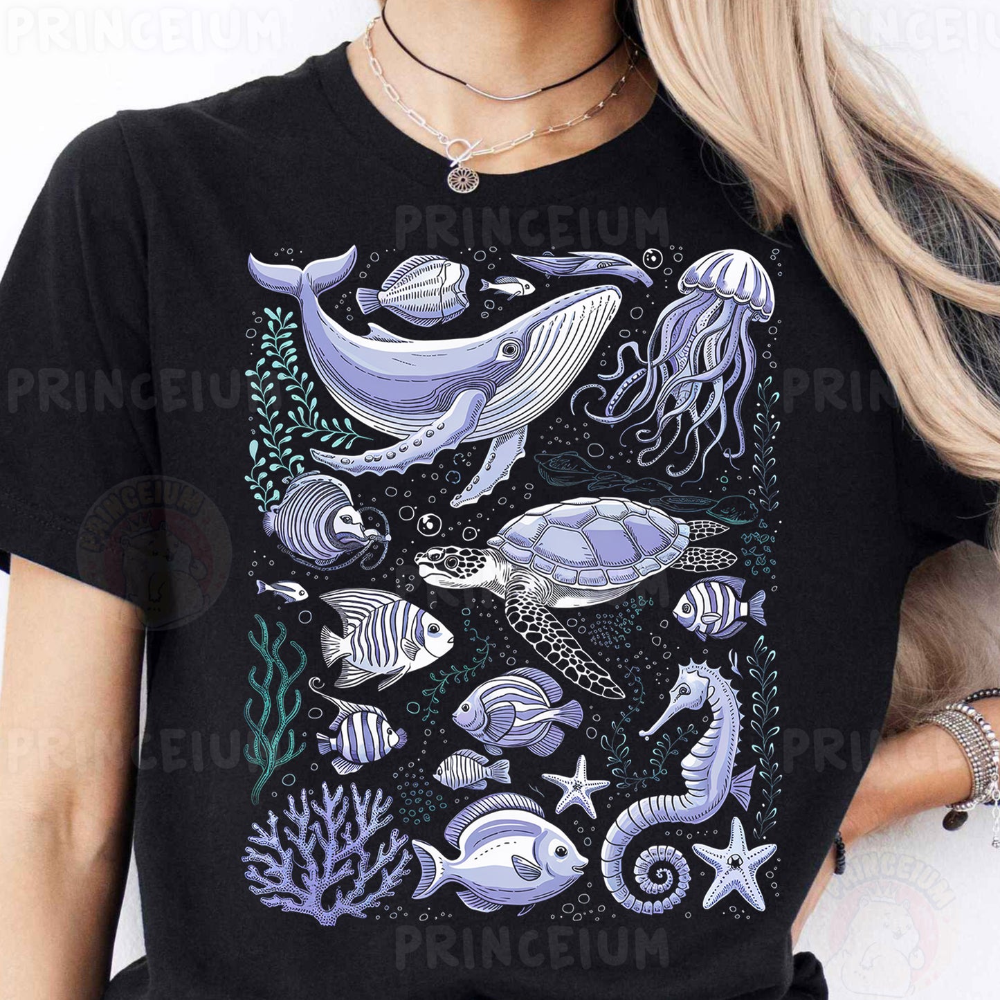 a woman wearing a black t - shirt with a picture of a whale and other