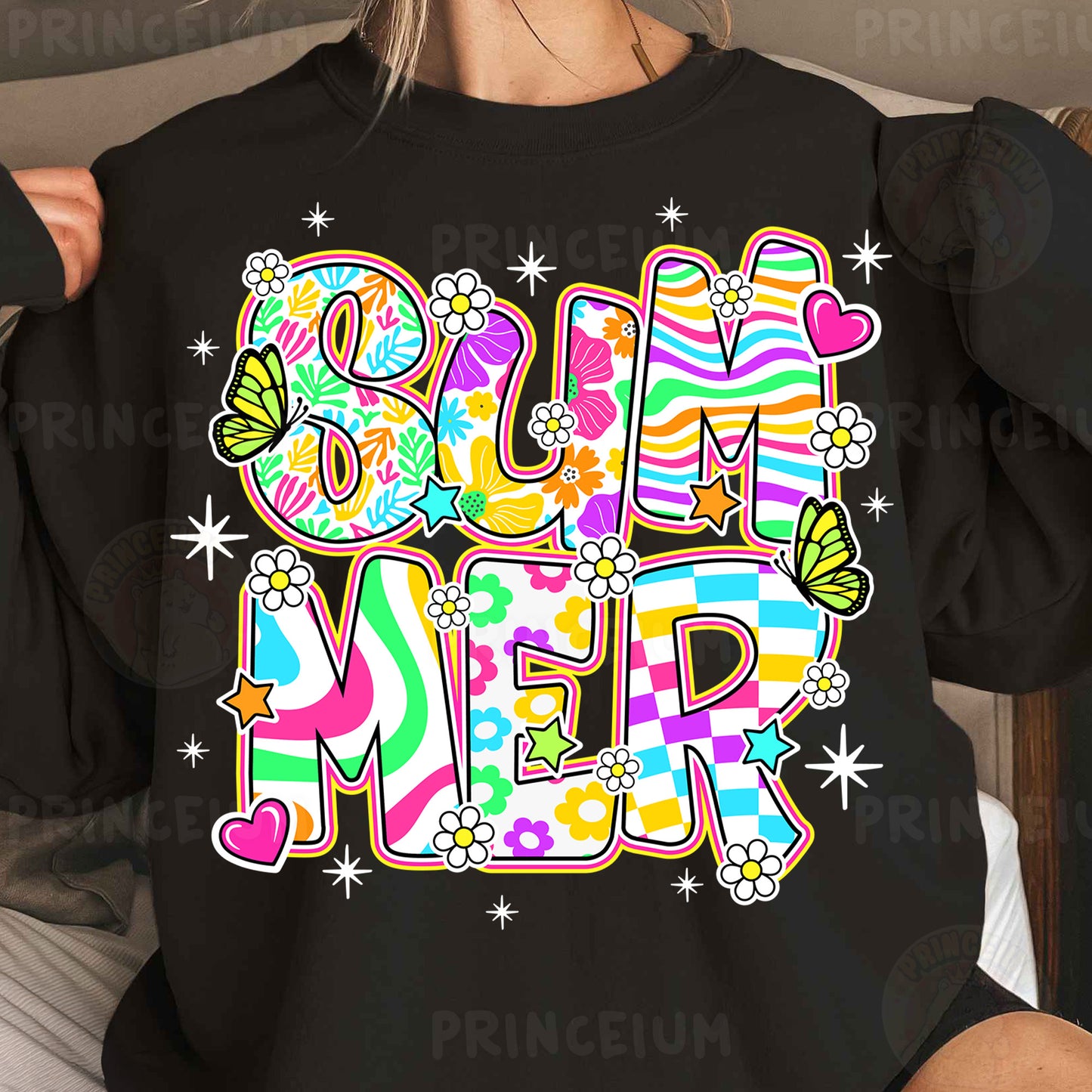 a woman wearing a black shirt with a colorful design on it