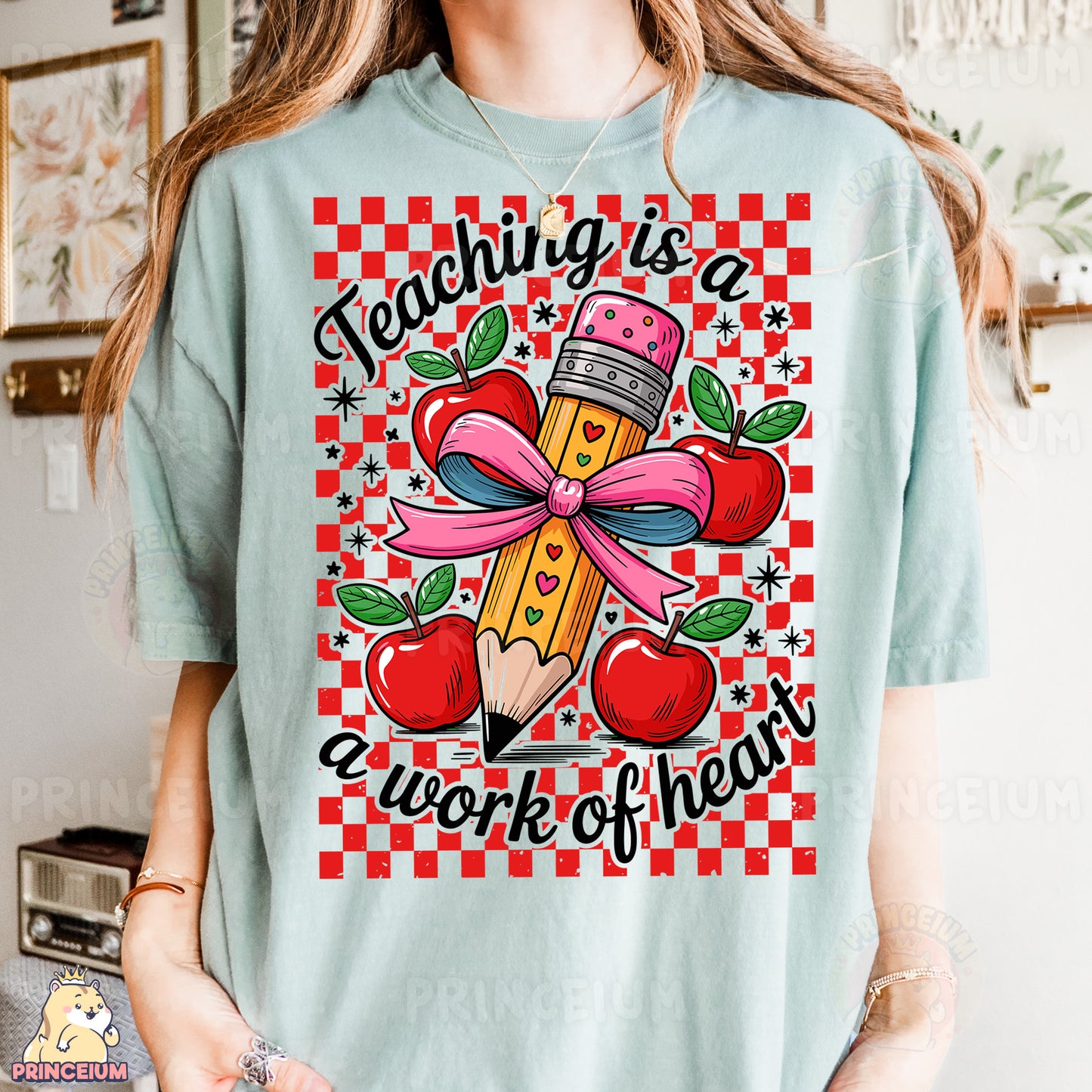 a girl wearing a t - shirt that says teaching is a work of heart