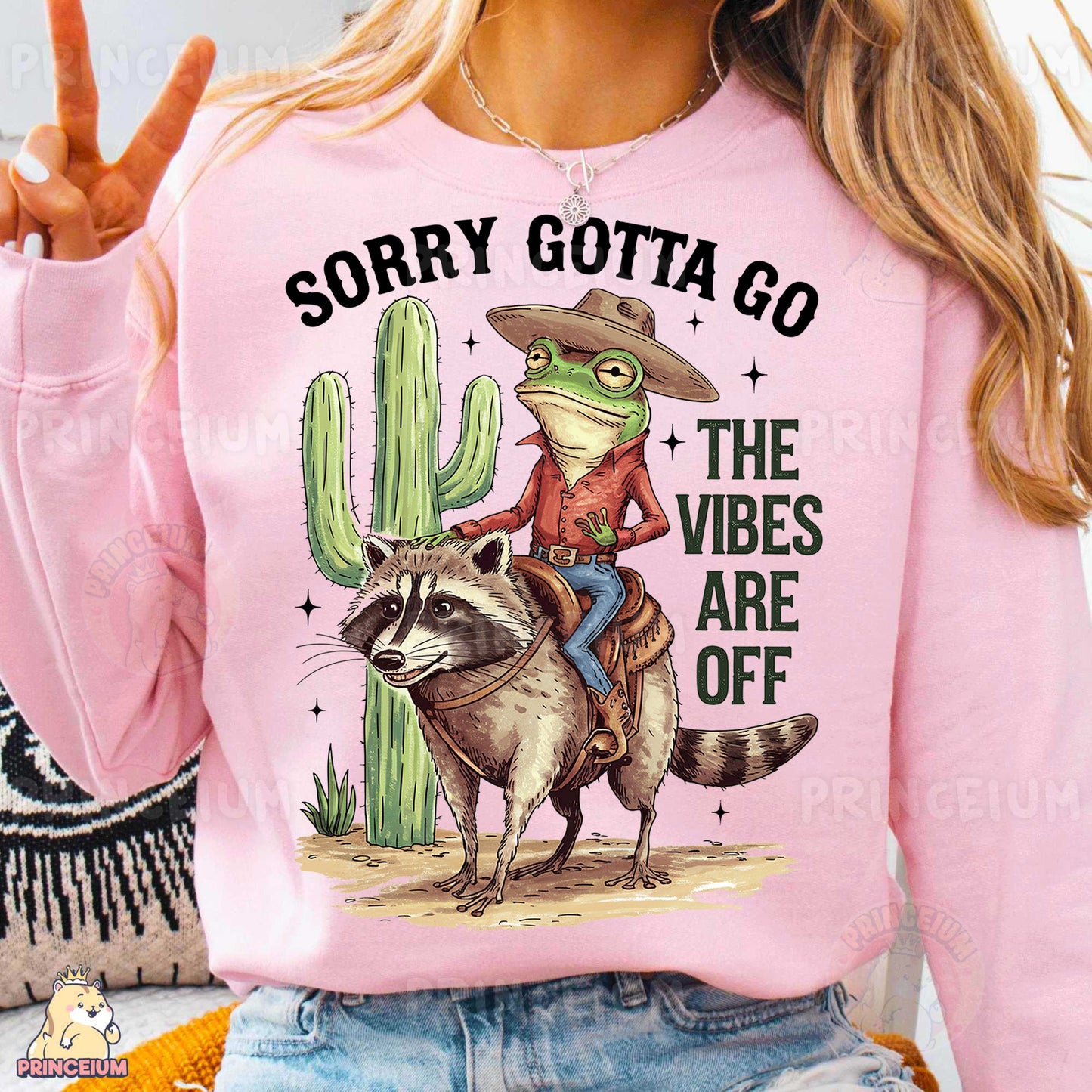 a woman wearing a pink shirt with a racoon on it
