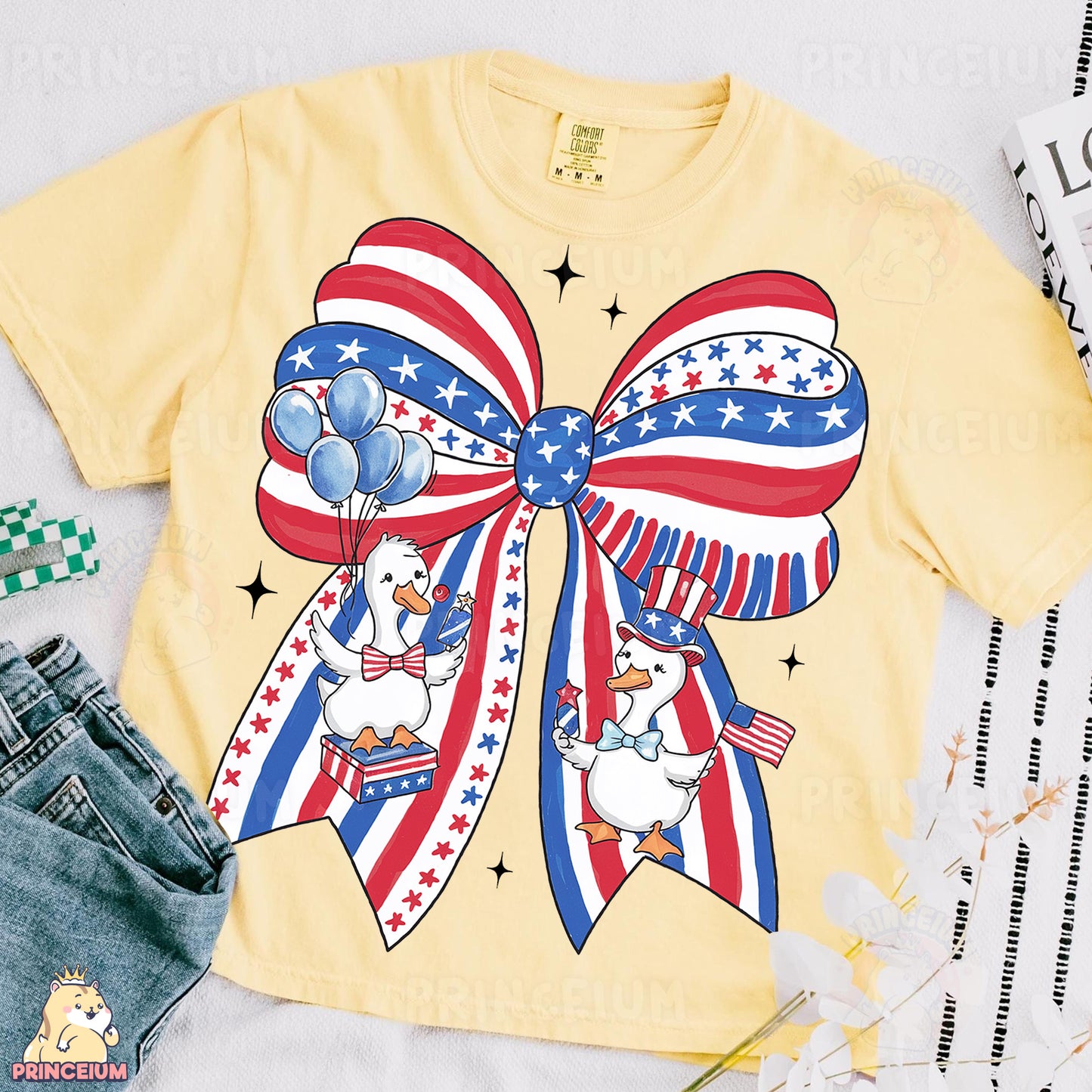 a t - shirt with a bow and balloons on it