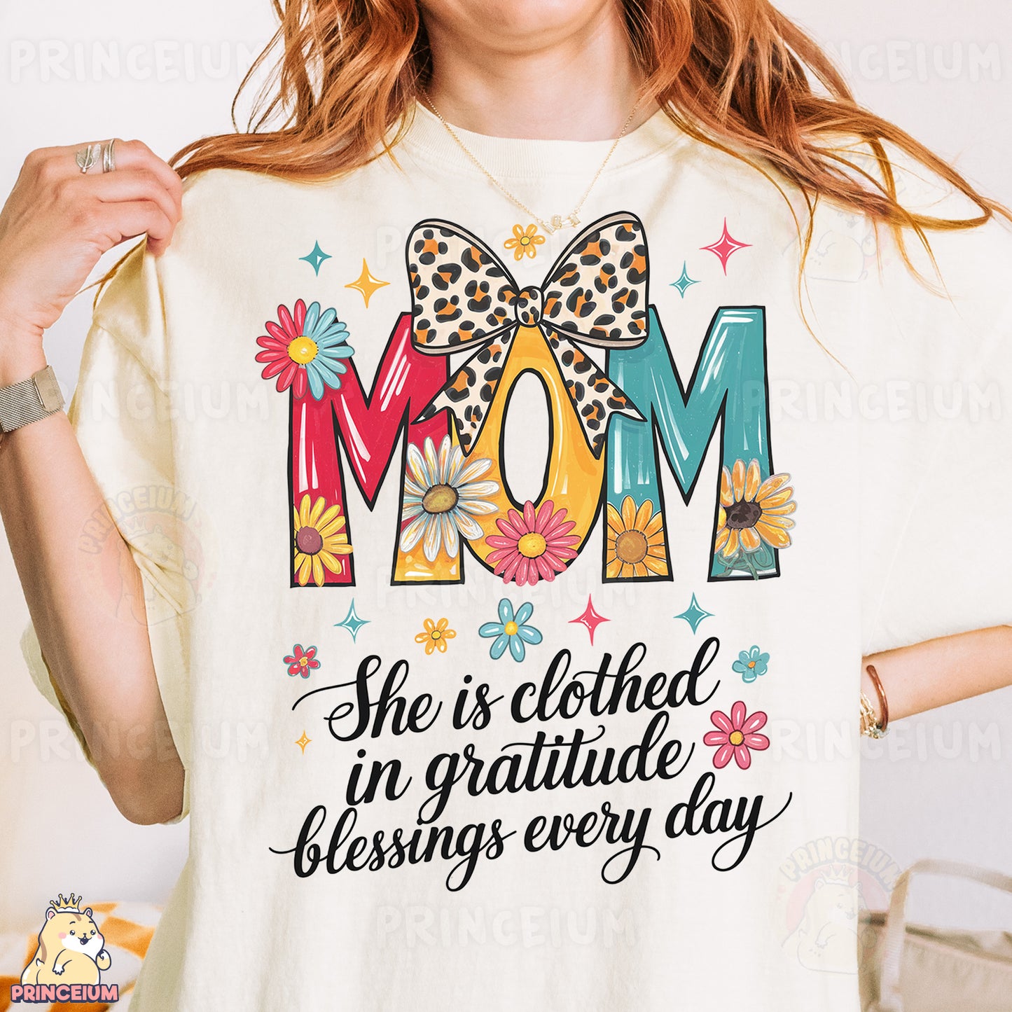 a woman wearing a t - shirt that says mom she is clothed in grati