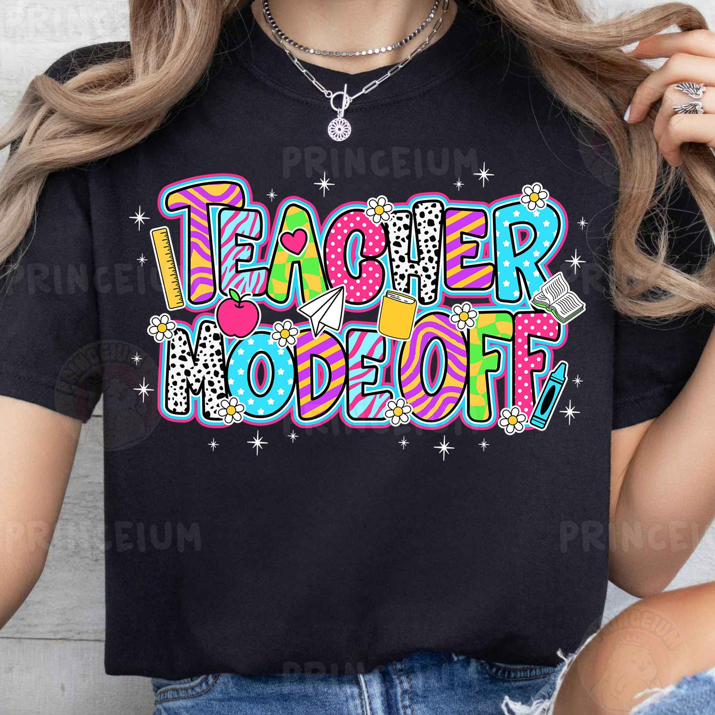 a woman wearing a black teacher to be t - shirt