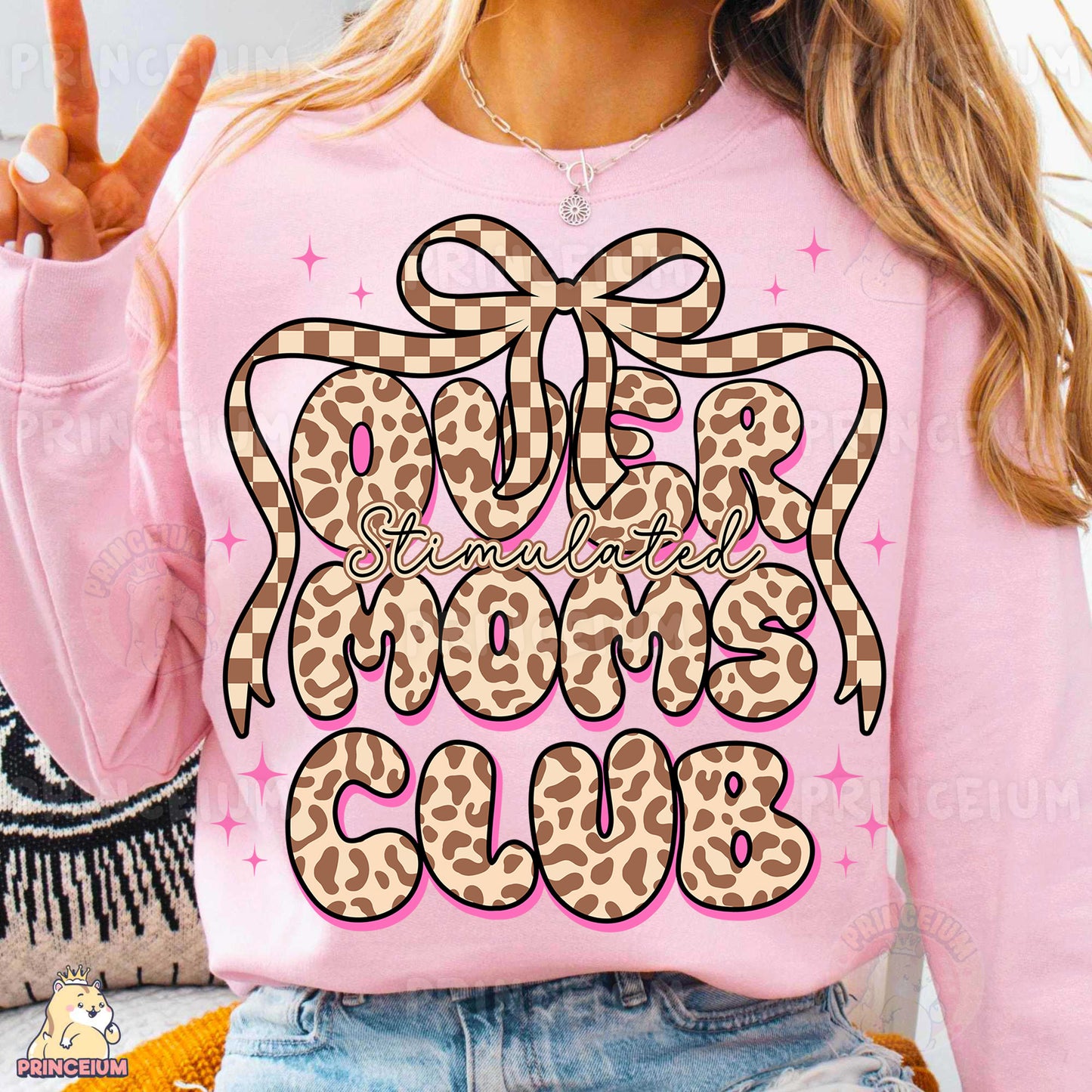a woman wearing a pink shirt with a leopard print on it