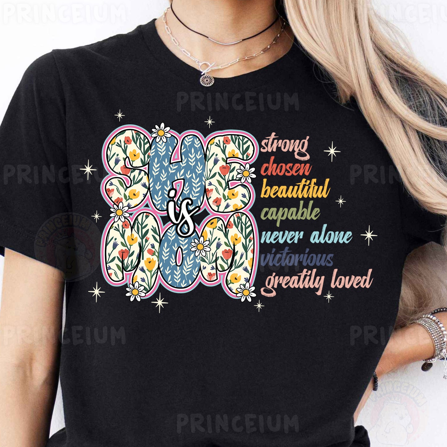 a woman wearing a black t - shirt with a colorful elephant on it