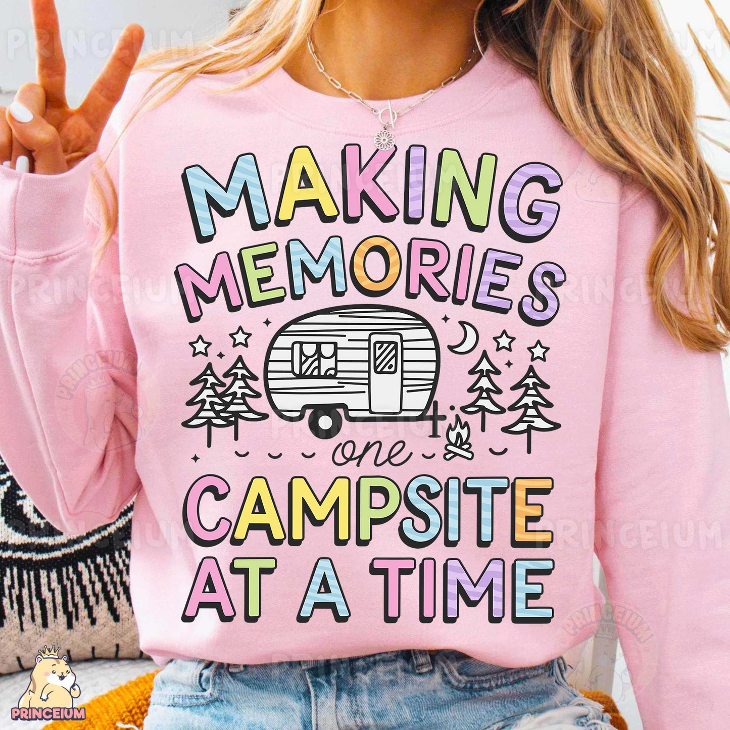 a woman wearing a pink shirt that says making memories is campsite at a time