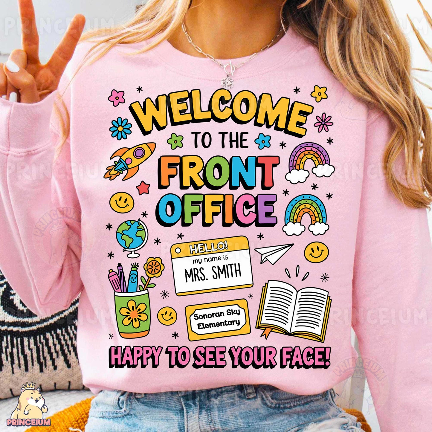 a woman wearing a pink shirt that says welcome to the front office