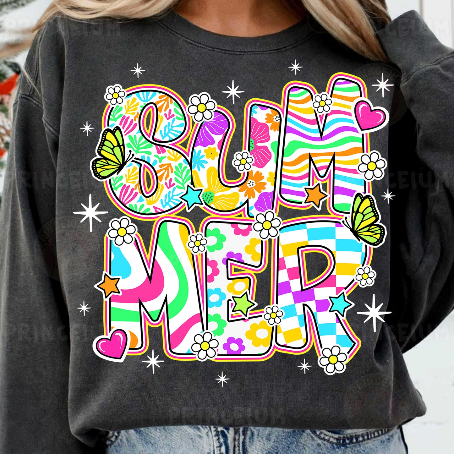 a woman wearing a black sweatshirt with the word mom on it