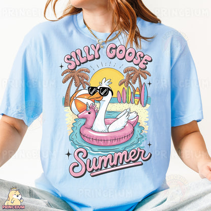 a woman wearing a blue shirt with a flamingo on it