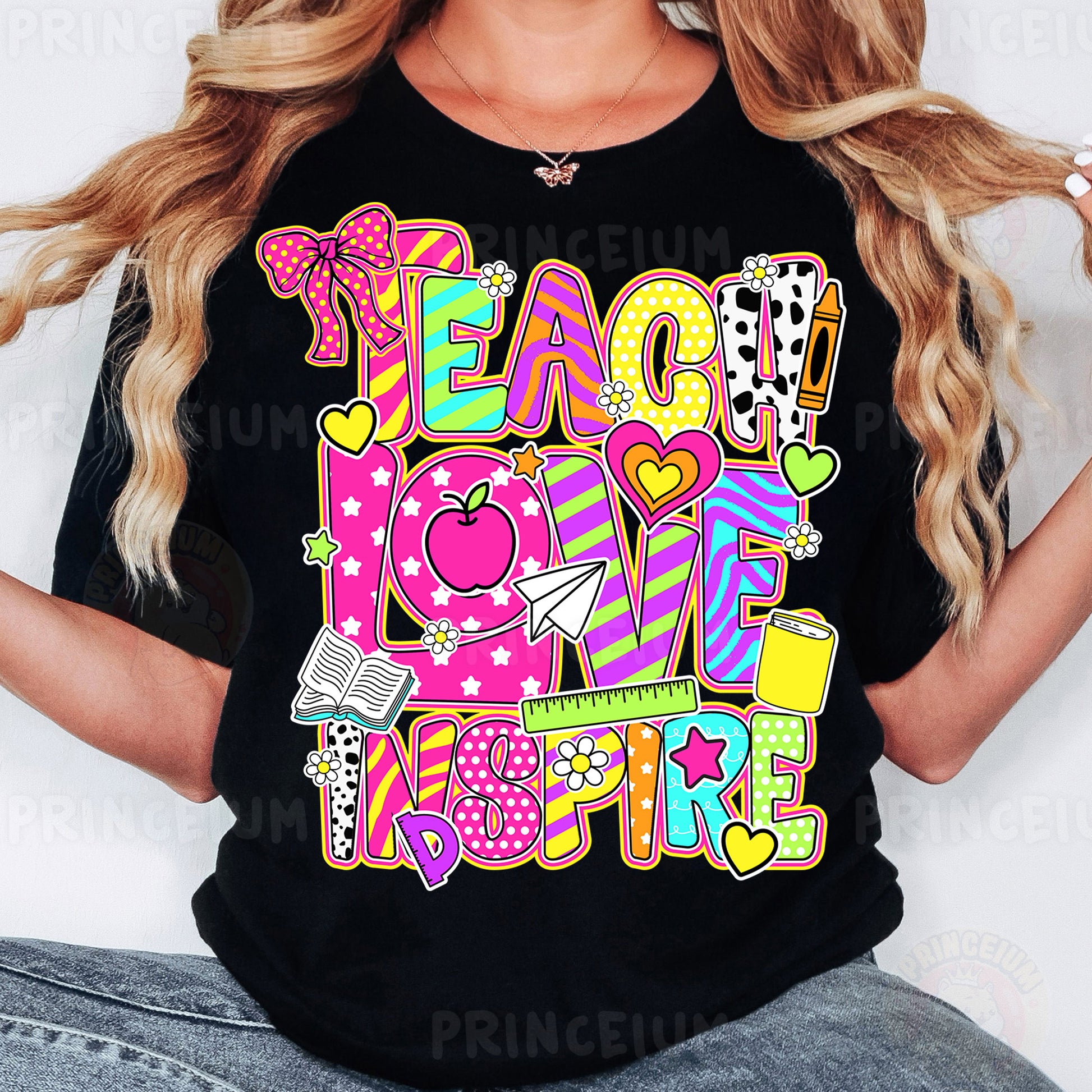 a woman wearing a t - shirt that says teach love inspire