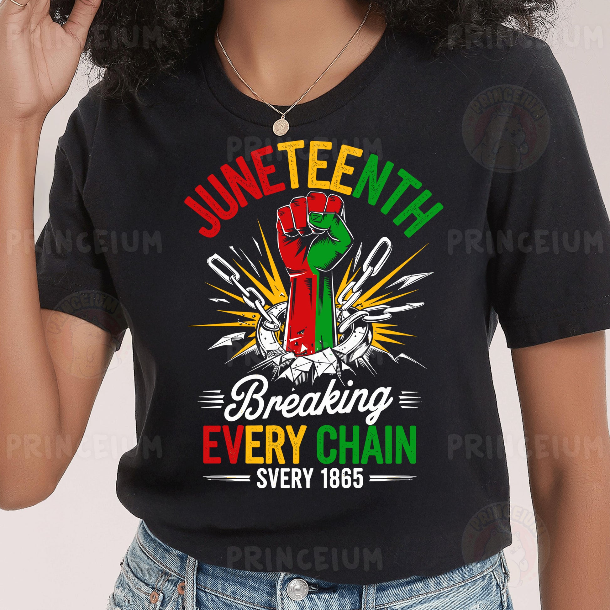 a woman wearing a black t - shirt with a green and red fist on it