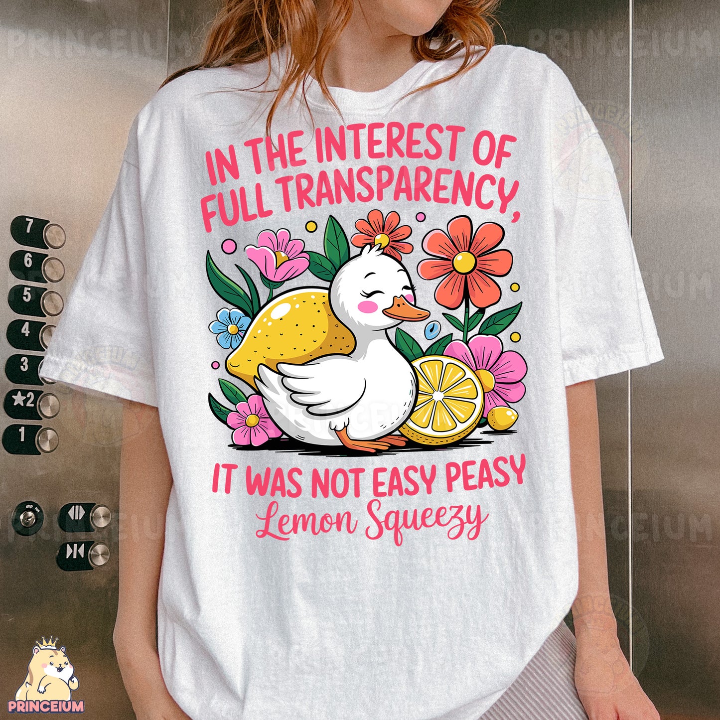 a woman wearing a white t - shirt with a picture of a duck and lemon