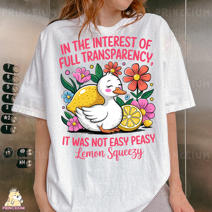 a woman wearing a white t - shirt with a picture of a duck and lemon