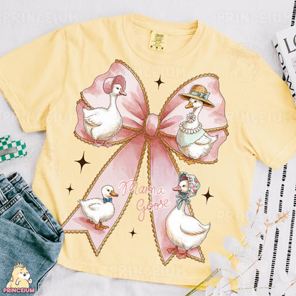 a yellow shirt with a pink bow and ducks on it