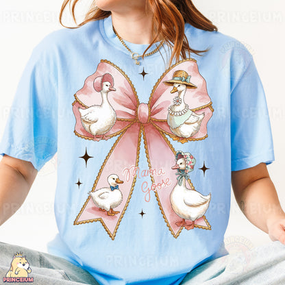 a woman wearing a blue shirt with a pink bow