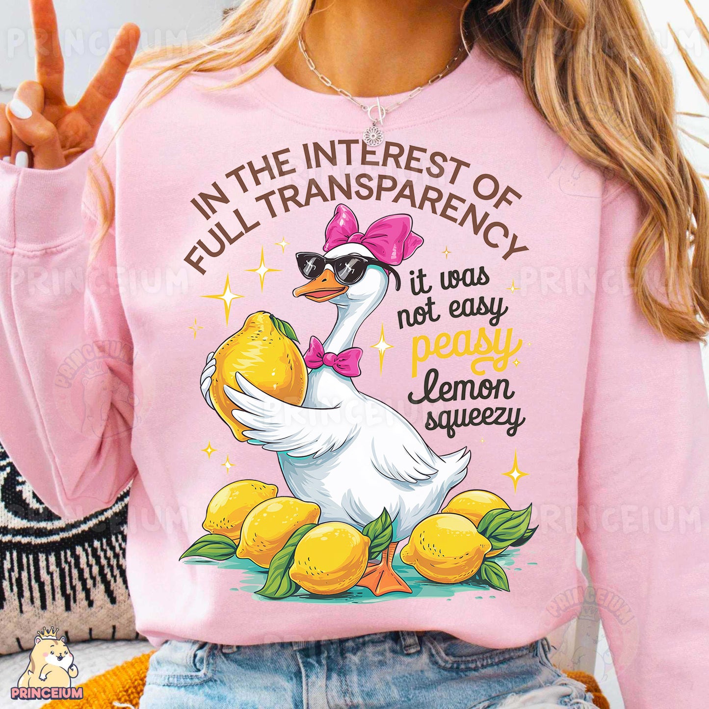 a woman wearing a pink sweater with a duck on it