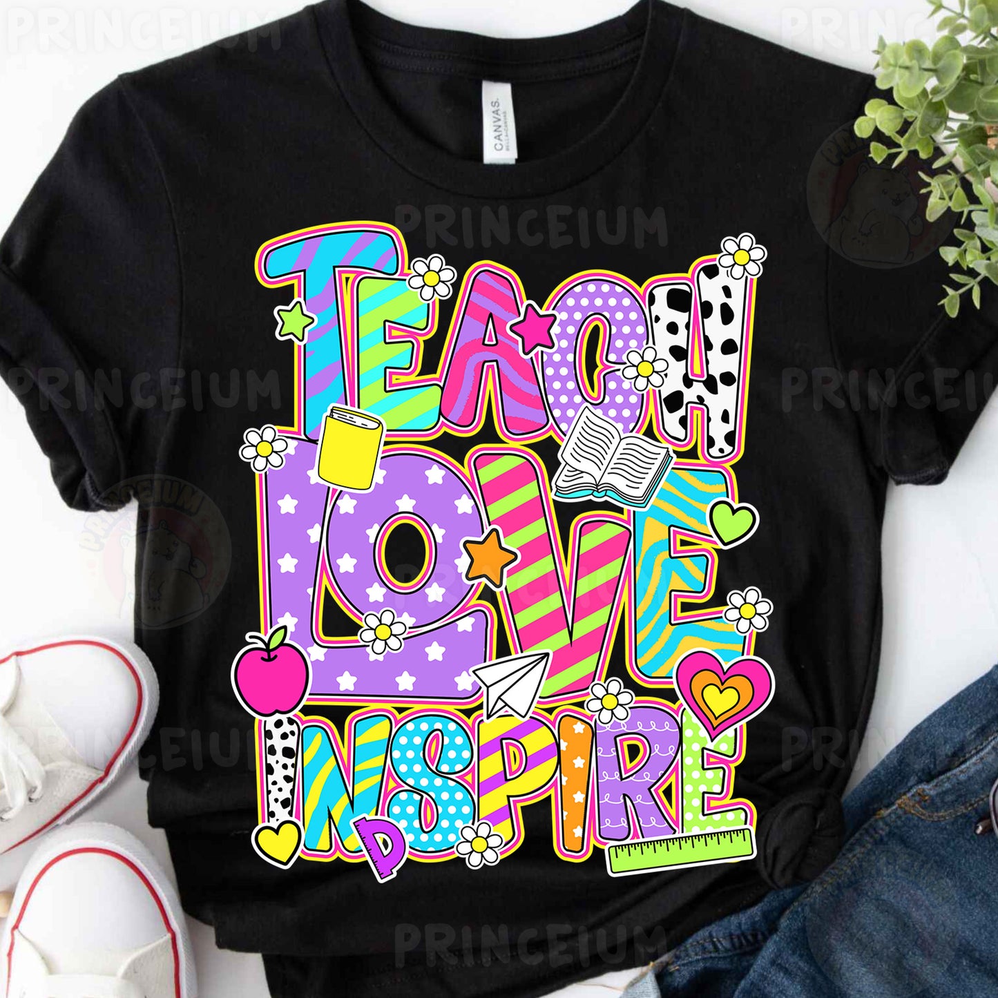 a t - shirt that says teach love inspire