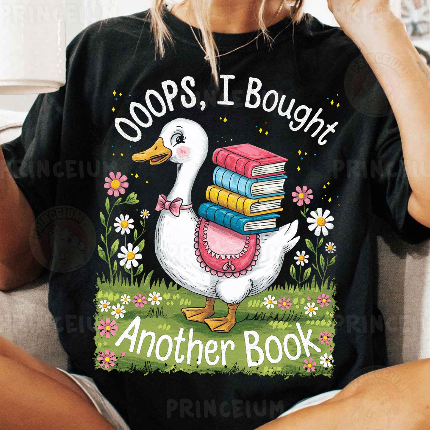 a woman sitting on a couch holding a stack of books