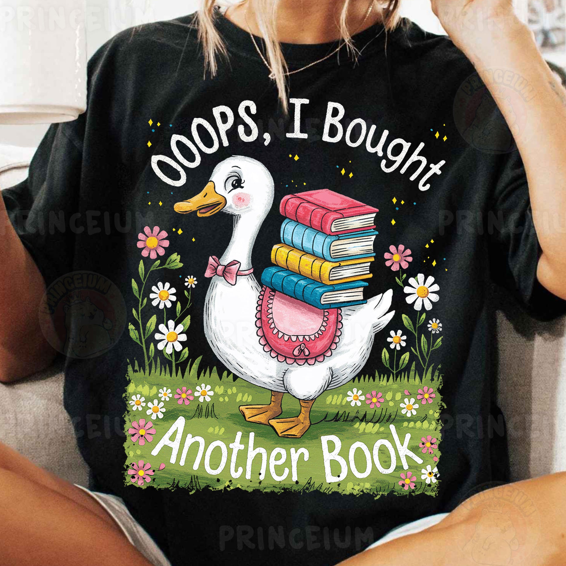 a woman sitting on a couch holding a stack of books