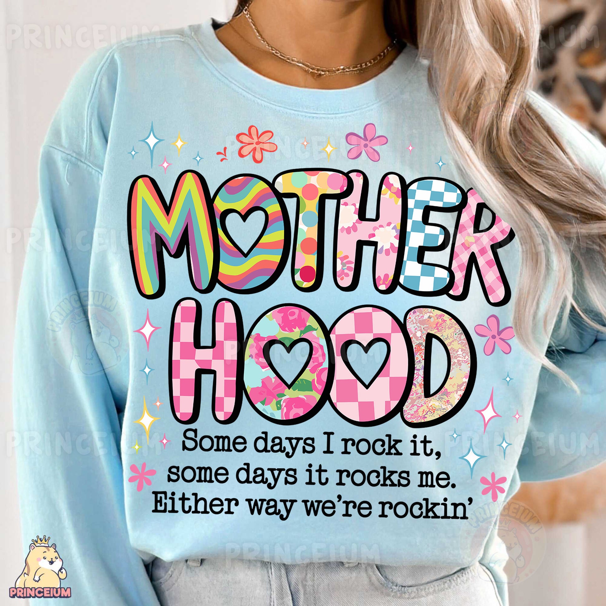 a woman wearing a sweatshirt that says motherhood