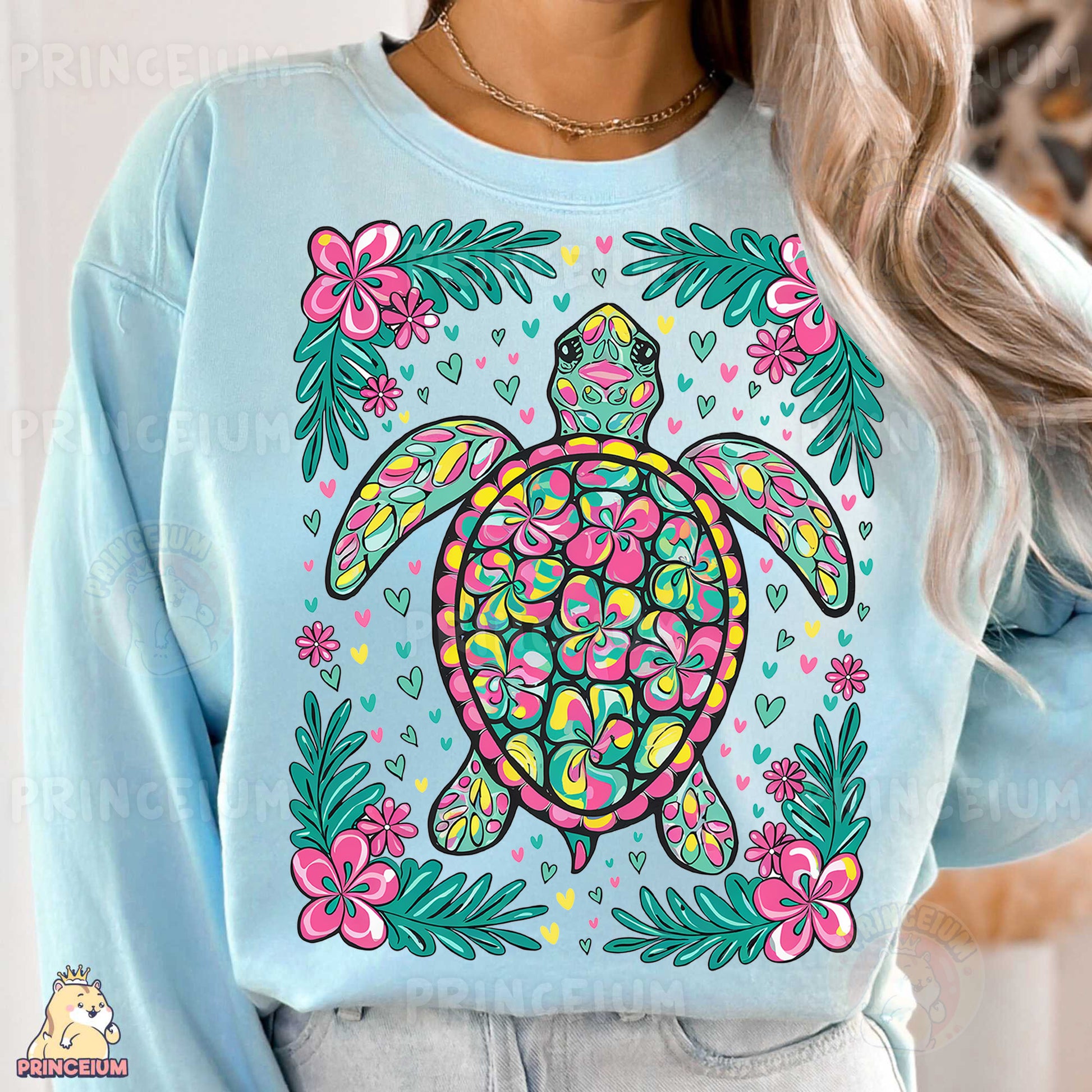 a woman wearing a blue sweater with a turtle on it