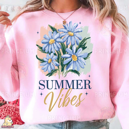 a woman wearing a pink sweatshirt with blue flowers on it