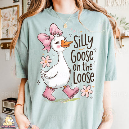 a woman wearing a silly goose on the loose shirt