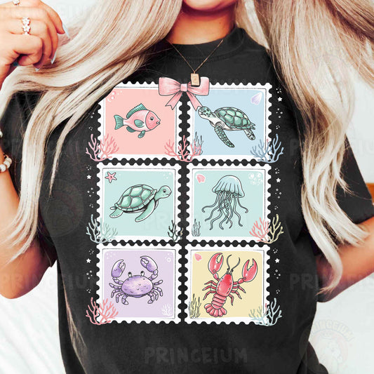 a woman wearing a t - shirt with stamps on it