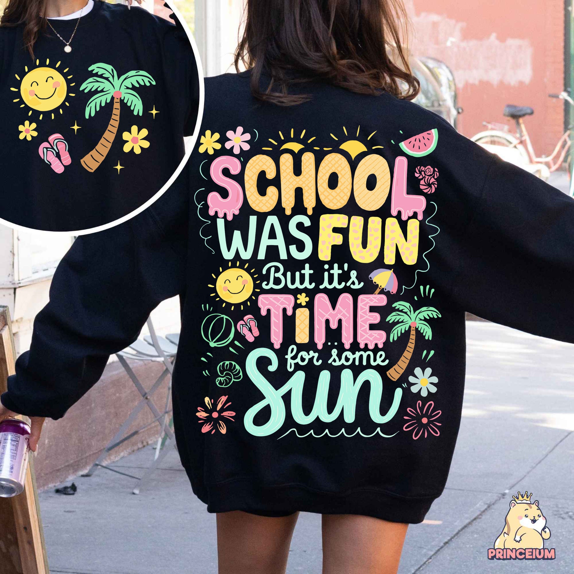 a woman walking down a street wearing a black sweatshirt