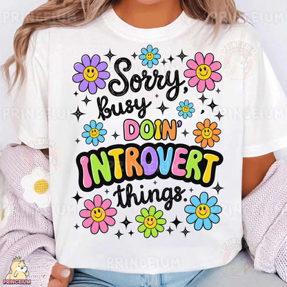 a woman wearing a white t - shirt that says sorry, but don't