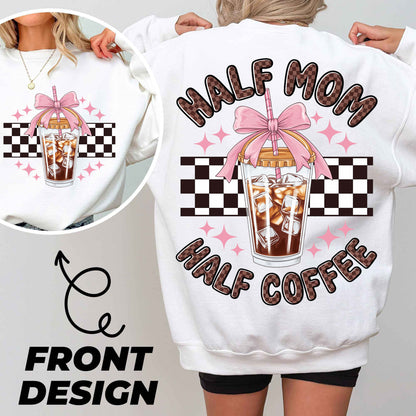 a woman wearing a white sweatshirt with a picture of a coffee drink on it