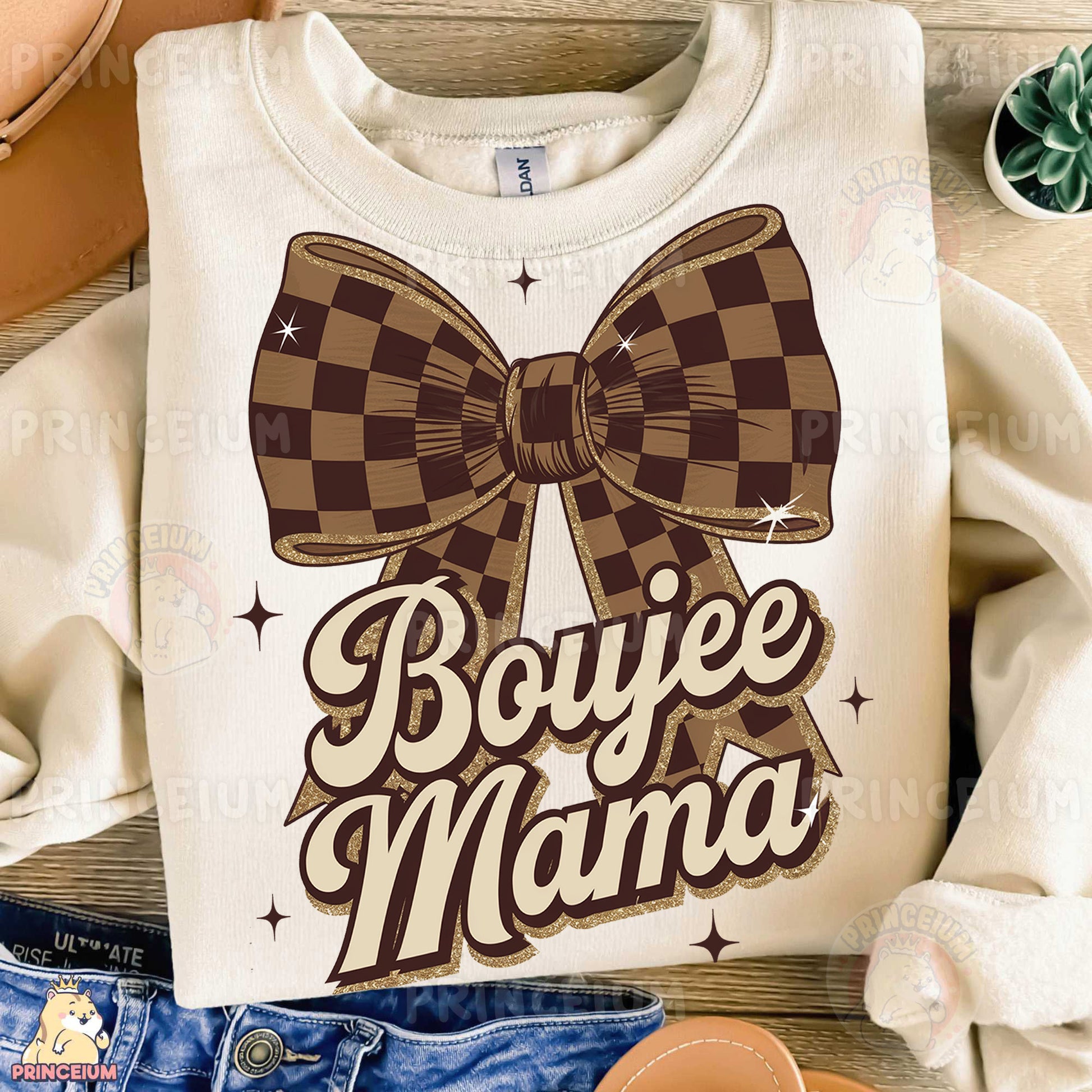 a t - shirt that says boyie mama with a bow on it