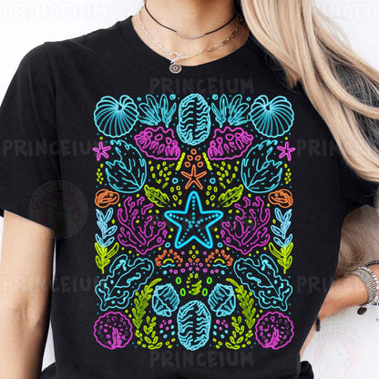 a woman wearing a black t - shirt with a colorful design on it