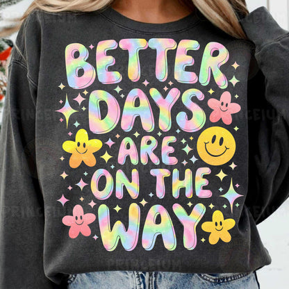 a woman wearing a sweatshirt that says better days are on the way