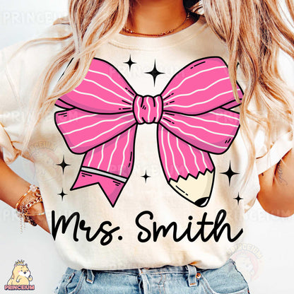 a woman wearing a t - shirt with a pink bow on it