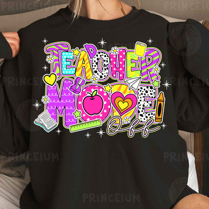 a woman wearing a black teacher mom shirt