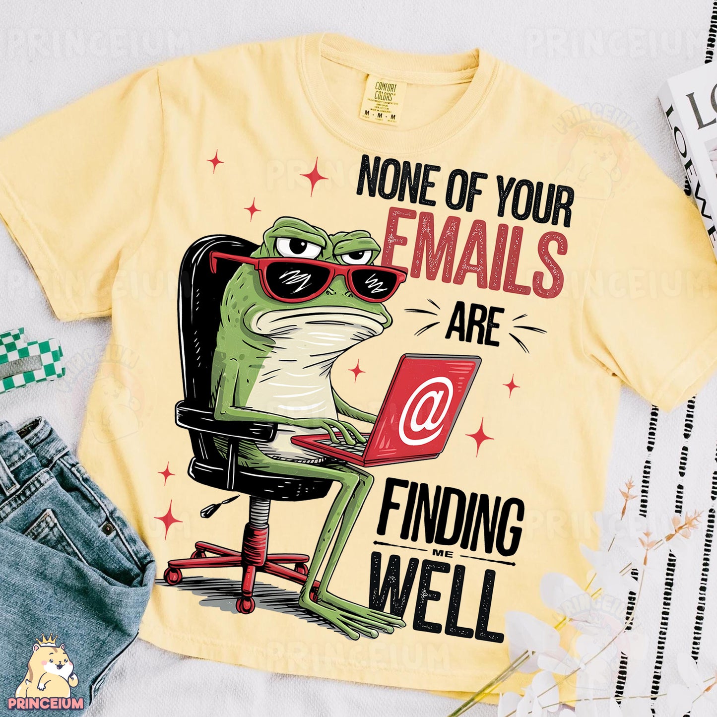 a t - shirt with an image of a frog on a computer