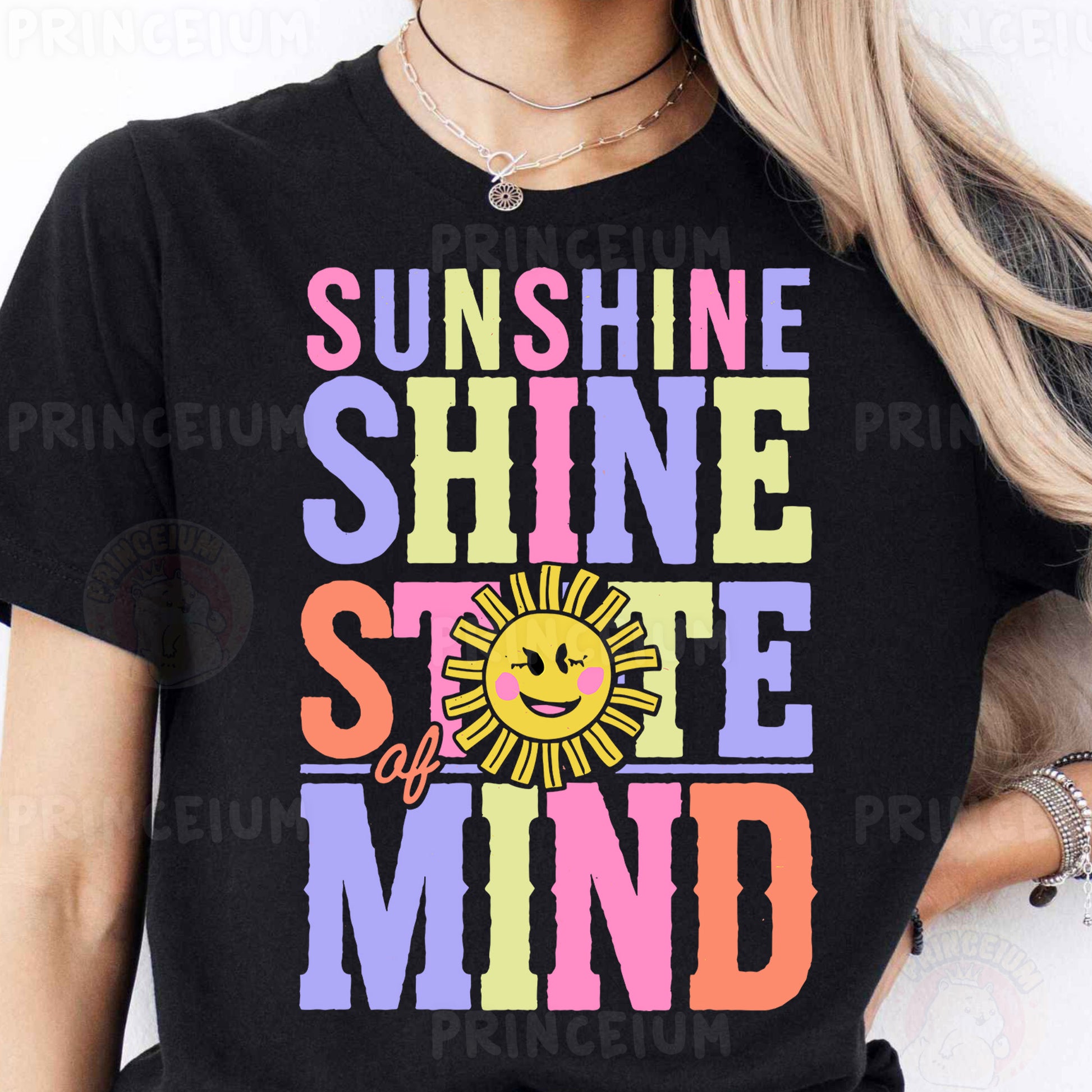 a woman wearing a black shirt that says sunshine shine smile mind