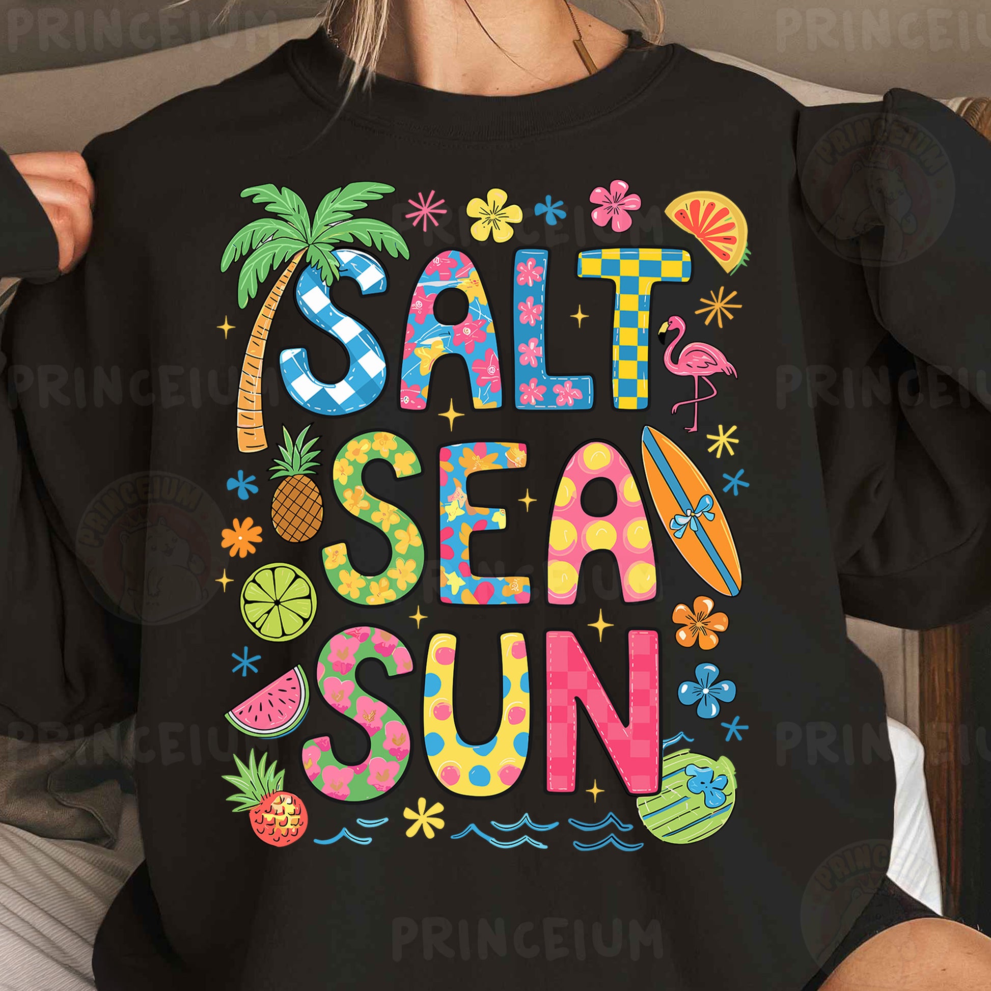 a woman wearing a black shirt that says salt sea sun