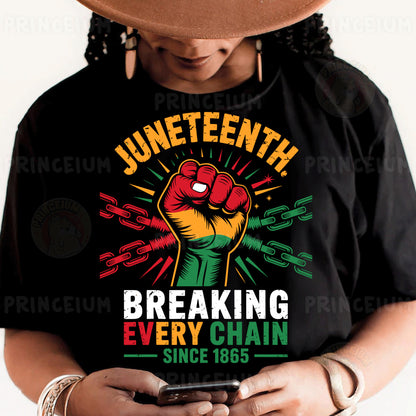 a person wearing a black shirt with a fist on it