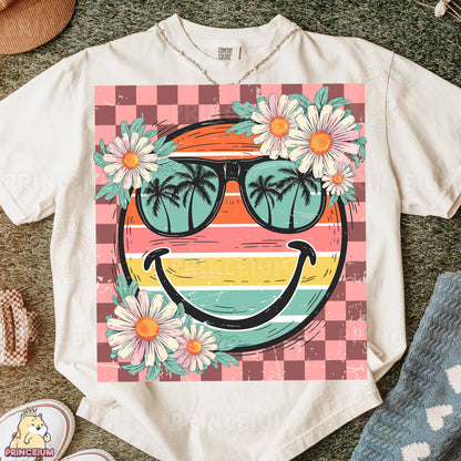 a t - shirt with a picture of a smiley face wearing sunglasses